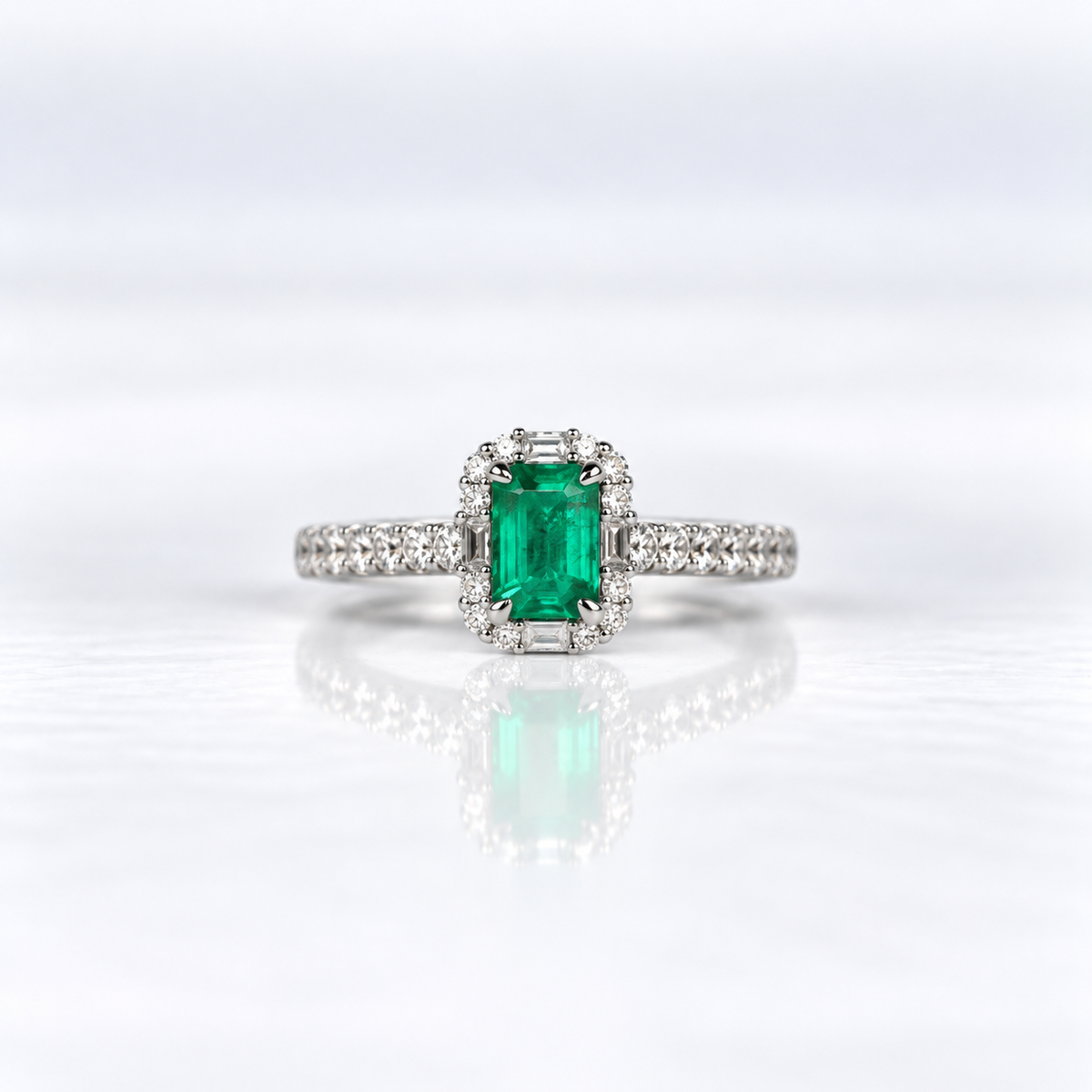 18ct White Gold Emerald and Diamond Halo Dress Ring